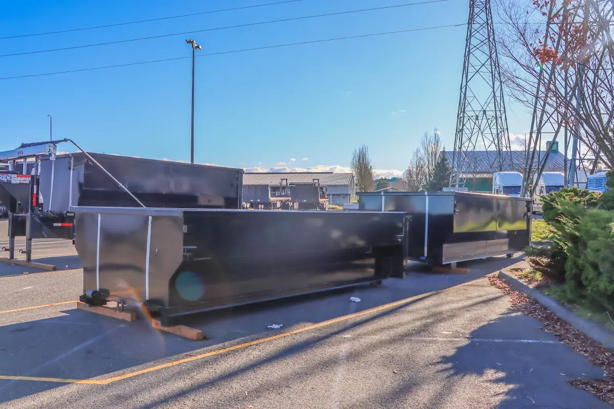 Roll-off dumpster ready for waste disposal at job site for Concrete Dumpster Rental in Gloucester